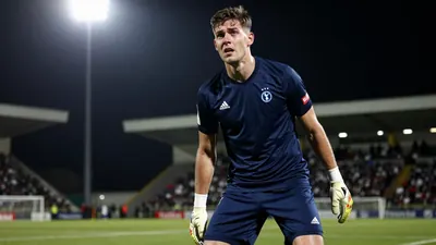 Falkirk's late rally fell short in a 2-1 loss at Celtic Park, leaving John McGlynn's side 11th in the Premiership table